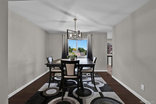 1065 Harbourne St, Colorado Springs, CO 80911 - dining room with baseboards, dark wood-style floors, and a chandelier
