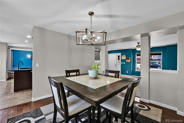 1065 Harbourne St, Colorado Springs, CO 80911 - dining space with recessed lighting, wood finished floors, baseboards, and a chandelier