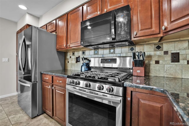 1065 Harbourne St, Colorado Springs, CO 80911 - kitchen with stainless steel appliances, decorative backsplash, baseboards, brown cabinets, and recessed lighting