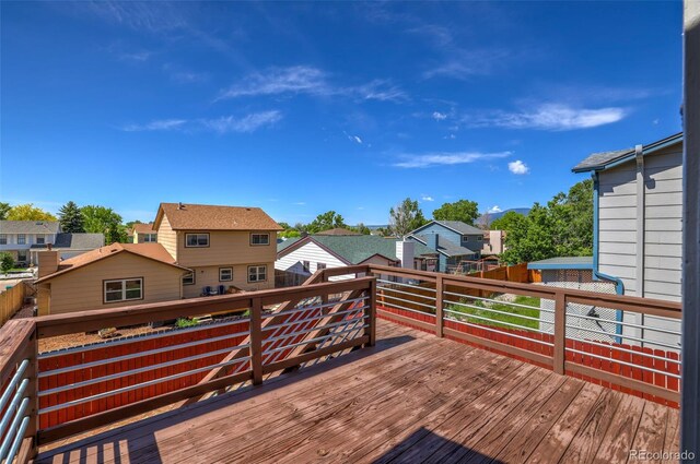 1065 Harbourne St, Colorado Springs, CO 80911 - wooden deck with a residential view