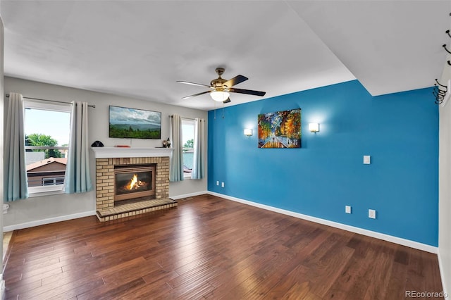 1065 Harbourne St, Colorado Springs, CO 80911 - unfurnished living room with a ceiling fan, healthy amount of natural light, baseboards, and a fireplace