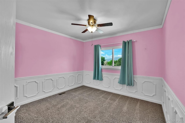 1065 Harbourne St, Colorado Springs, CO 80911 - carpeted empty room featuring a ceiling fan, wainscoting, and ornamental molding