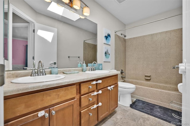 1065 Harbourne St, Colorado Springs, CO 80911 - bathroom featuring  shower combination, toilet, double vanity, and a skylight
