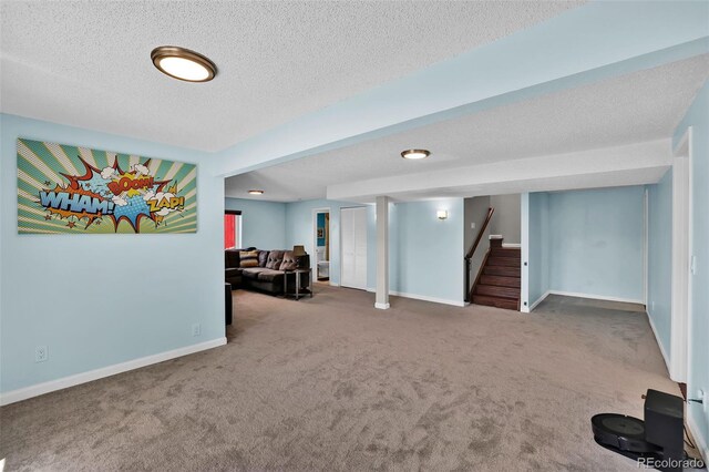 1065 Harbourne St, Colorado Springs, CO 80911 - basement with carpet, stairway, baseboards, and a textured ceiling