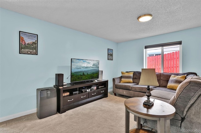 1065 Harbourne St, Colorado Springs, CO 80911 - living area with light carpet, a textured ceiling, and baseboards