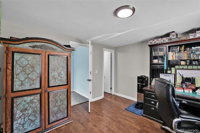 1065 Harbourne St, Colorado Springs, CO 80911 - office space featuring dark wood-style flooring and baseboards