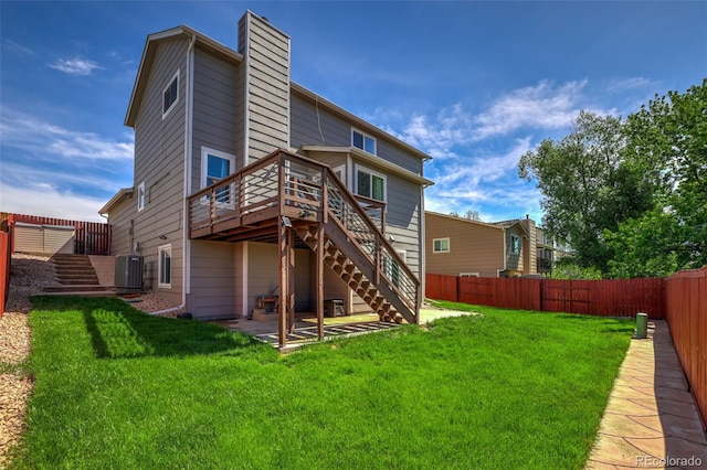 1065 Harbourne St, Colorado Springs, CO 80911 - back of house with stairs, a wooden deck, a patio area, a chimney, and cooling unit