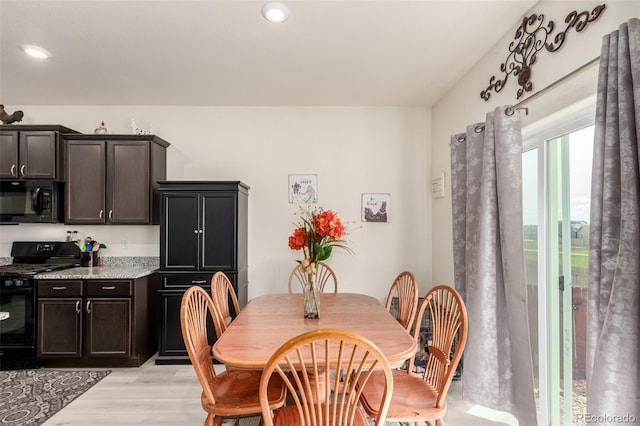 318 Thomas Ave, Keenesburg, CO 80643 - dining area featuring light wood-style floors and recessed lighting