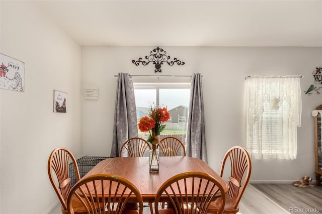 318 Thomas Ave, Keenesburg, CO 80643 - dining room featuring baseboards and wood finished floors