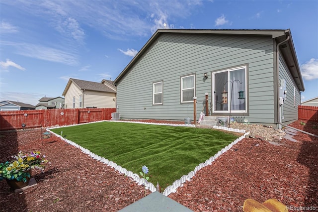 318 Thomas Ave, Keenesburg, CO 80643 - rear view of property featuring central air condition unit