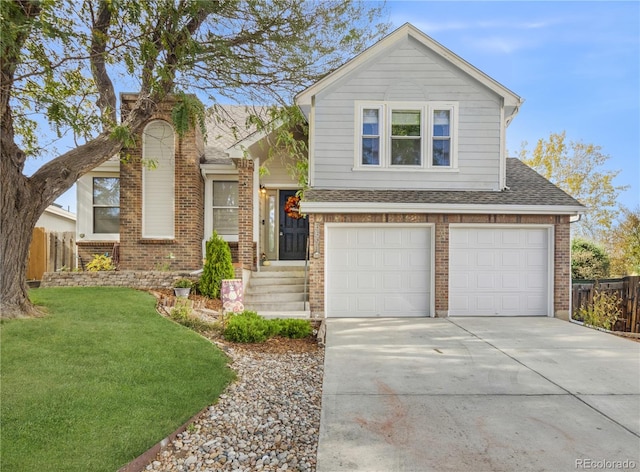 view of front of house featuring a garage and a front yard