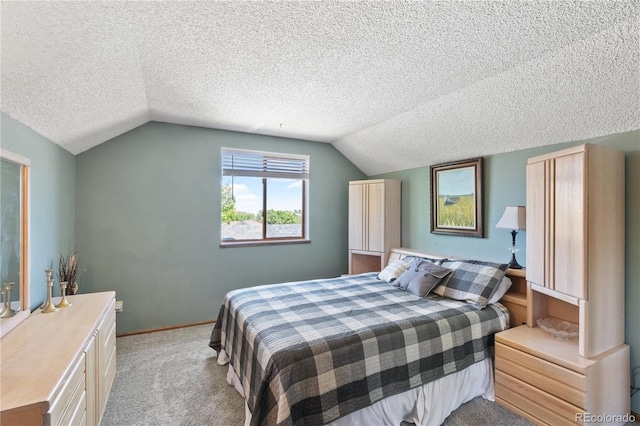 carpeted bedroom with lofted ceiling and a textured ceiling