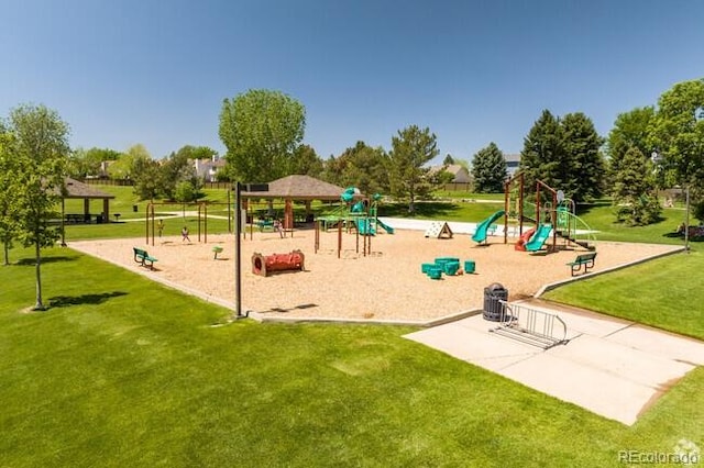 view of jungle gym with a lawn