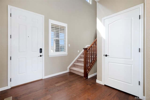 foyer entrance with dark wood-type flooring