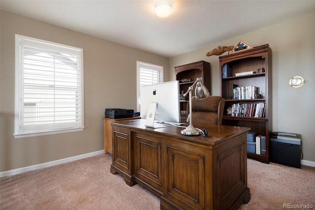 office area featuring light colored carpet and baseboards