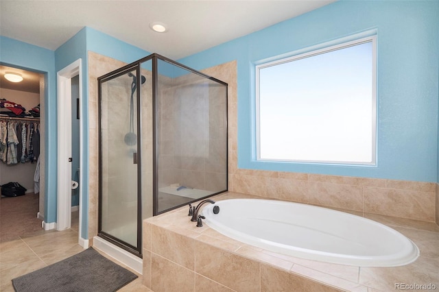 bathroom featuring independent shower and bath and tile patterned floors