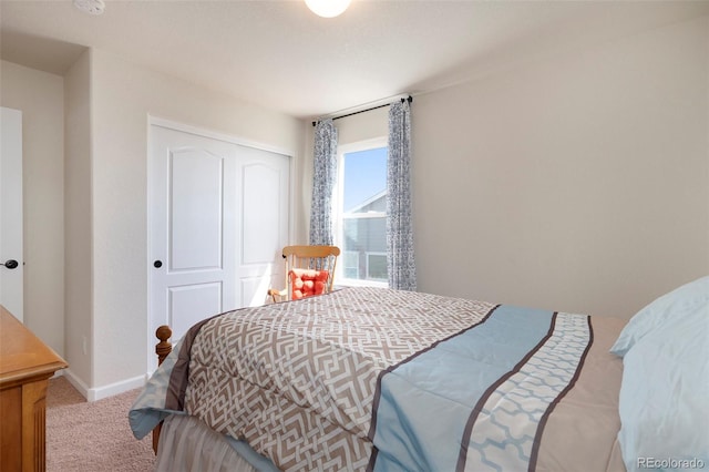 carpeted bedroom with a closet