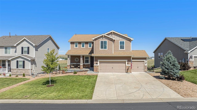 craftsman-style house featuring a front yard and a garage