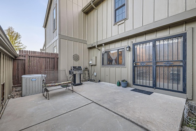 view of patio / terrace with area for grilling, central AC, and fence