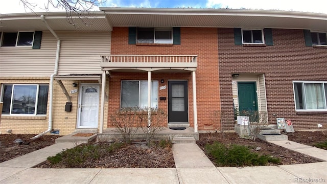 townhome / multi-family property with brick siding