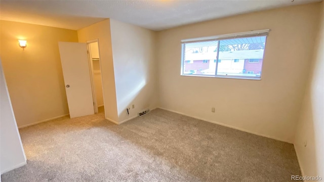 unfurnished bedroom featuring a closet and carpet flooring