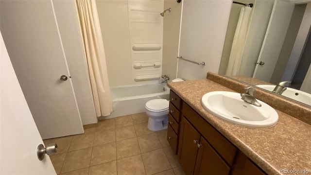 full bath featuring tile patterned floors, shower / tub combo with curtain, toilet, and vanity