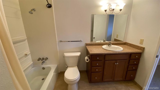 bathroom featuring vanity, baseboards, tile patterned flooring, toilet, and shower / bathtub combination