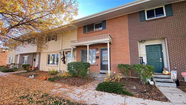 view of property featuring brick siding