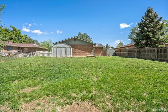 view of yard with a shed and an outbuilding