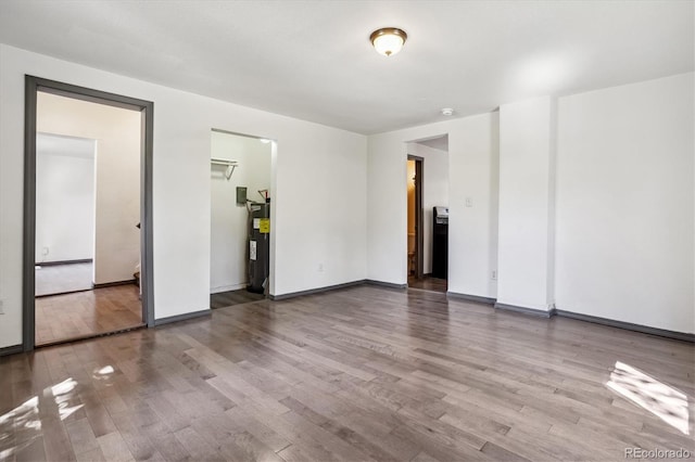 646 Maple St, Colorado Springs, CO 80903 - unfurnished room with wood finished floors and electric water heater