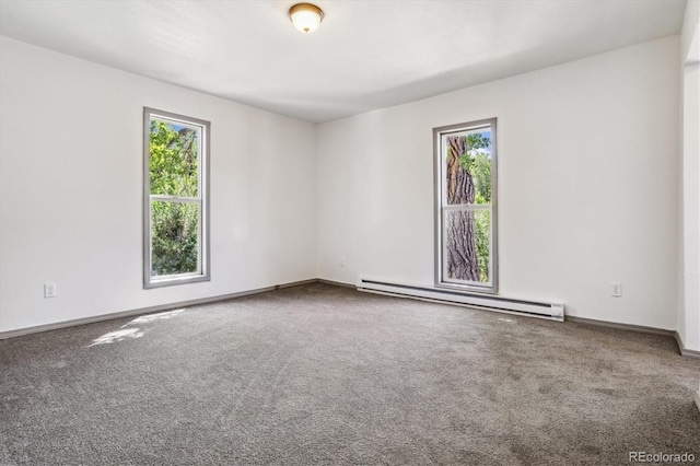 646 Maple St, Colorado Springs, CO 80903 - spare room with a baseboard heating unit, plenty of natural light, and carpet floors