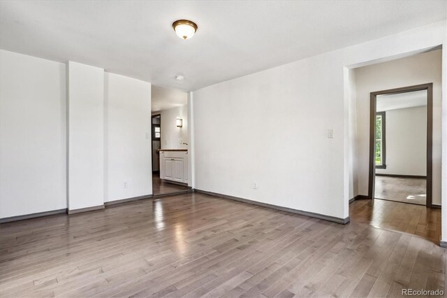 646 Maple St, Colorado Springs, CO 80903 - unfurnished bedroom with wood finished floors and ensuite bathroom