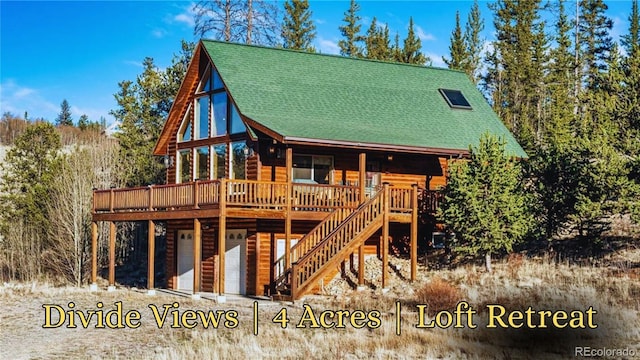 1081 Travois Rd, Como, CO 80432 - back of house with a deck, stairway, and faux log siding