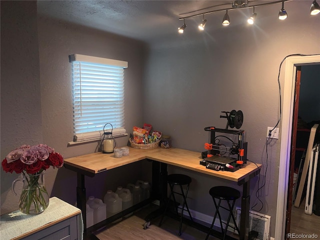 office space with hardwood / wood-style floors