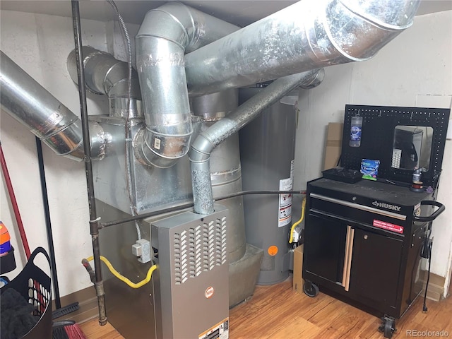 utility room featuring water heater