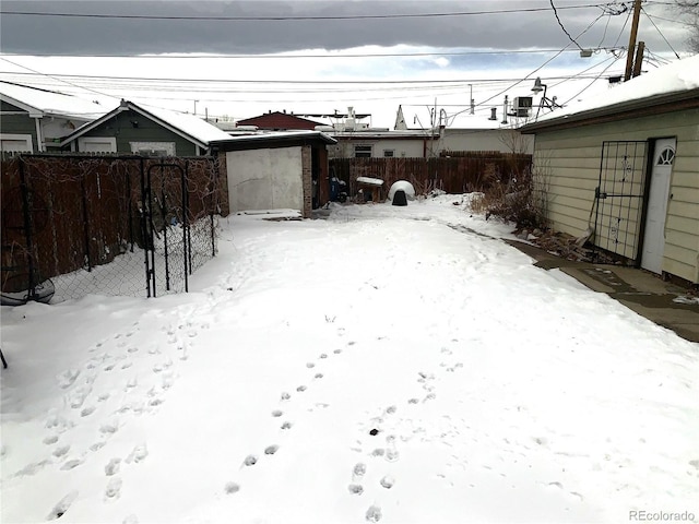 snowy yard with central air condition unit