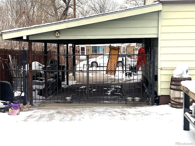 view of snow covered gate