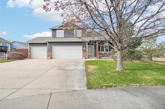 view of front of house featuring a front lawn and a garage