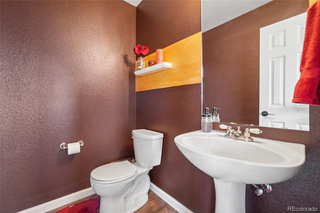 bathroom with sink and toilet