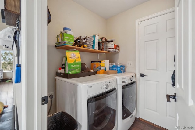 laundry room featuring independent washer and dryer and dark wood-type flooring