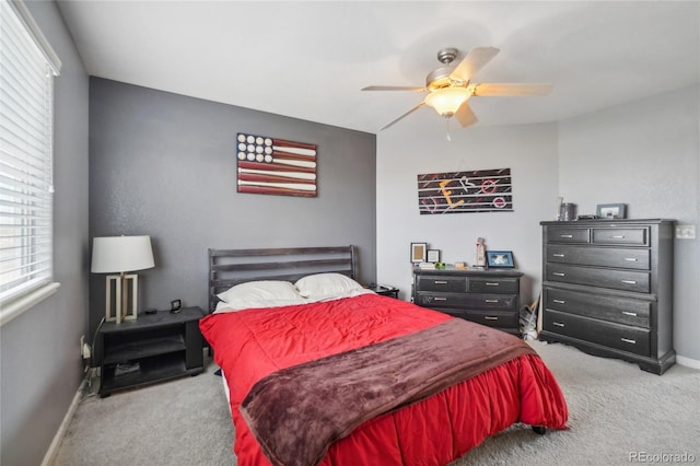 bedroom with ceiling fan and light carpet