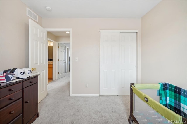 carpeted bedroom featuring a closet