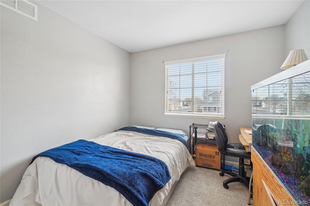 bedroom with light colored carpet