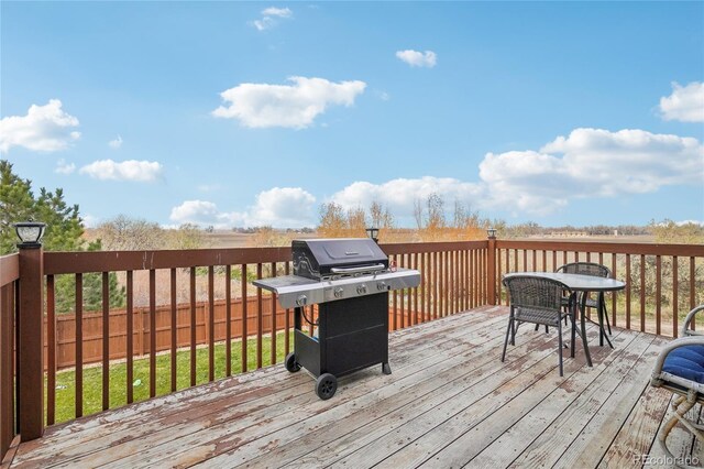 wooden terrace featuring area for grilling