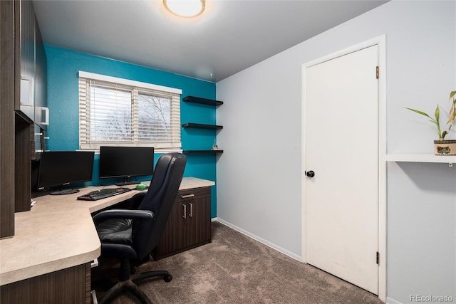 carpeted office space featuring baseboards