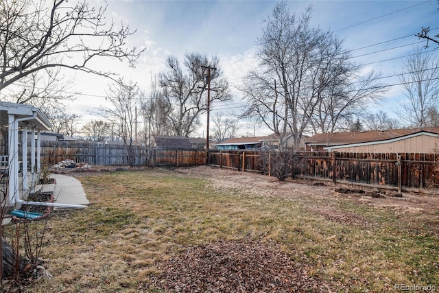 view of yard with a fenced backyard