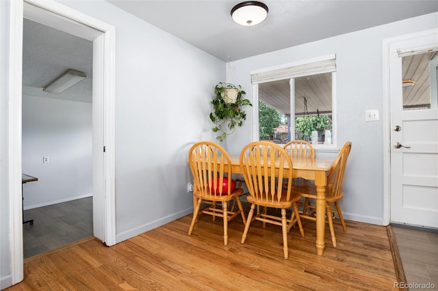 6903 W 52nd Pl, Arvada, CO 80002 - dining room featuring wood finished floors and baseboards