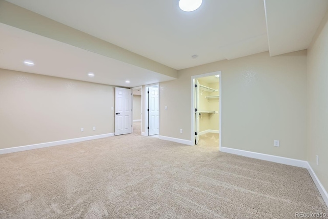 unfurnished room featuring recessed lighting, baseboards, and light colored carpet