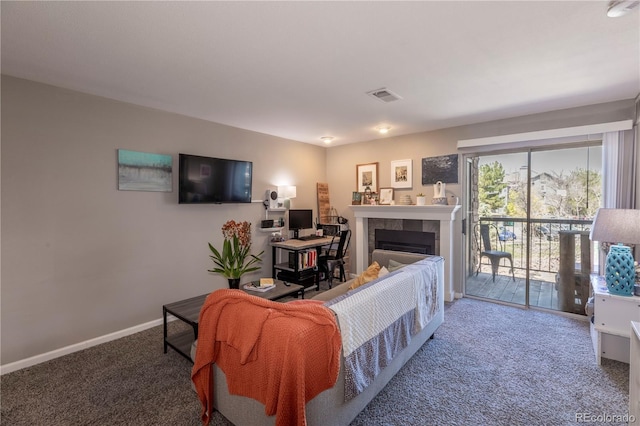 carpeted living room featuring baseboards, a tile fireplace, and visible vents