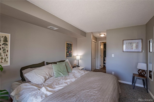 bedroom featuring a textured ceiling, baseboards, visible vents, a closet, and carpet floors